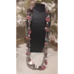 Handcrafted double-line gemstone necklace featuring grey and white agate beads, labradorite stones, and pink mother of pearl accents displayed on a black jewelry bust with soft floral background.