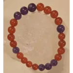 Handcrafted Carnelian and Amethyst gemstone bracelet featuring polished 8mm orange-red and purple beads, symbolizing protection from the evil eye, courage, balance, and spiritual harmony.