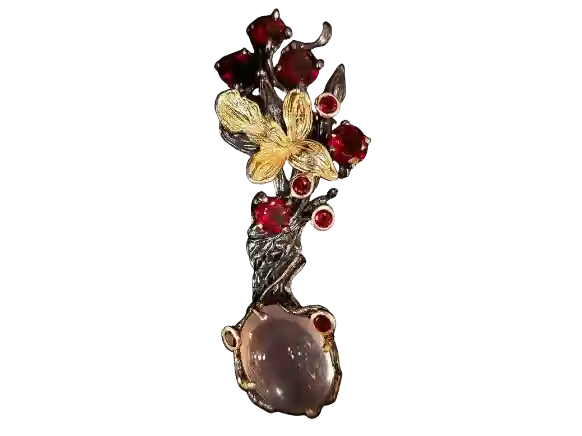 Handcrafted black silver pendant with natural rose quartz, garnet gemstones, and gold-plated floral accents.