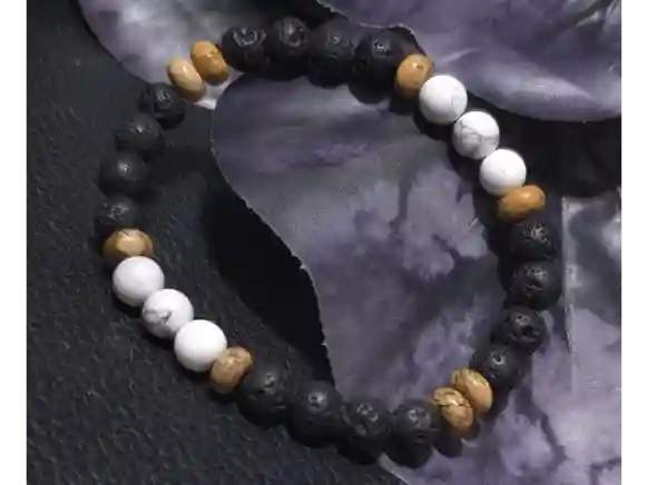 Handcrafted lava stone, howlite, and picture jasper bracelet with natural 6mm gemstone beads displayed on a dark textured background.