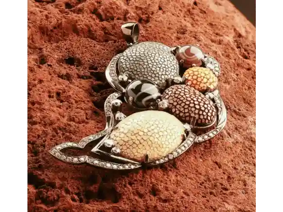 Handcrafted sterling silver pendant featuring genuine stingray leather, natural agate stones, and crystal accents in an ocean-inspired artisan design.